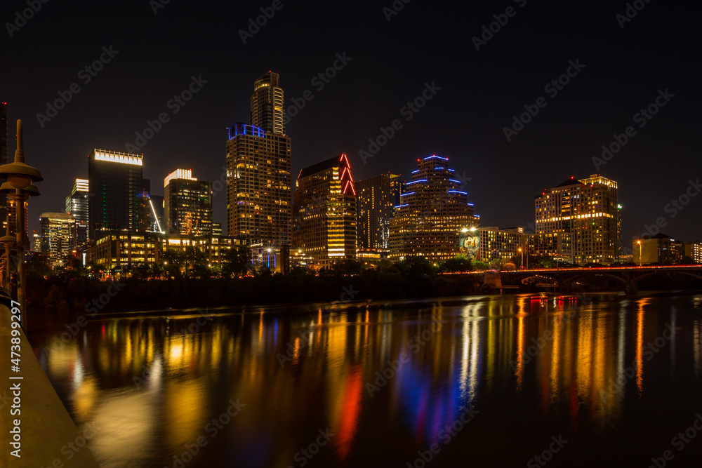 Beautiful night Austin cityscape over Colorado river. Texas, USA