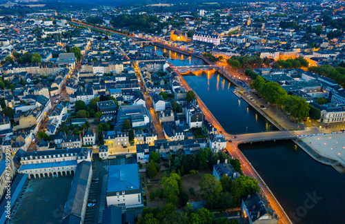 Laval city and Mayenne river in the evening. View from above. France