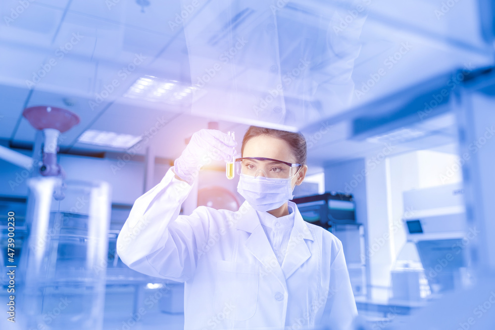 Female scientist looking at the scientific sample in the CDC laboratory Female scientist looking at the scientific sample in the CDC laboratory