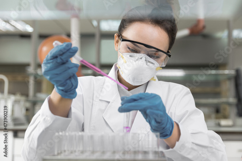 Young female scientist working in laboratory 