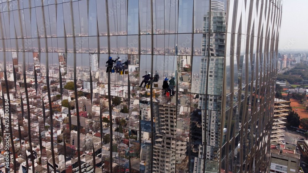 Amazing unusual aerial view of window cleaners on Buenos Aires skyscraper