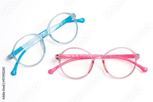 optical kid pink and blue frame eyeglasses on white background.