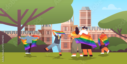 mix race people holding lgbt rainbow flags gay lesbian love parade pride festival transgender love concept