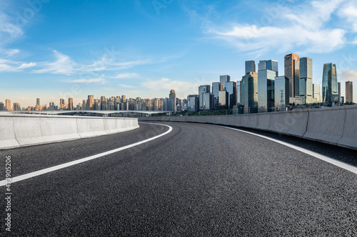 Panoramic skyline and modern commercial office buildings with empty road. Asphalt road and cityscape. © ABCDstock