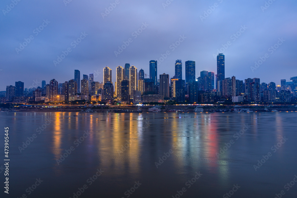 Panoramic skyline and modern commercial buildings in Chongqing at night