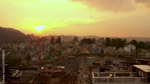 4k Drone over Chichicastenango Guatemala - stunning sunrise footage over ancient colorful graveyard, super unique little south american town that makes you want to adventure and travel. photo