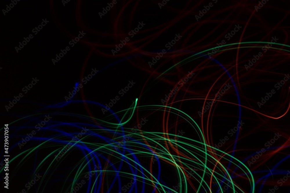 Multicolored neon lights on black background Multicolored neon lights on black background