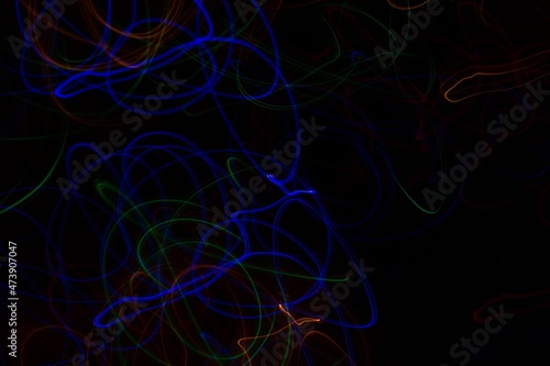 Multicolored neon lights on black background © Юля Стасик