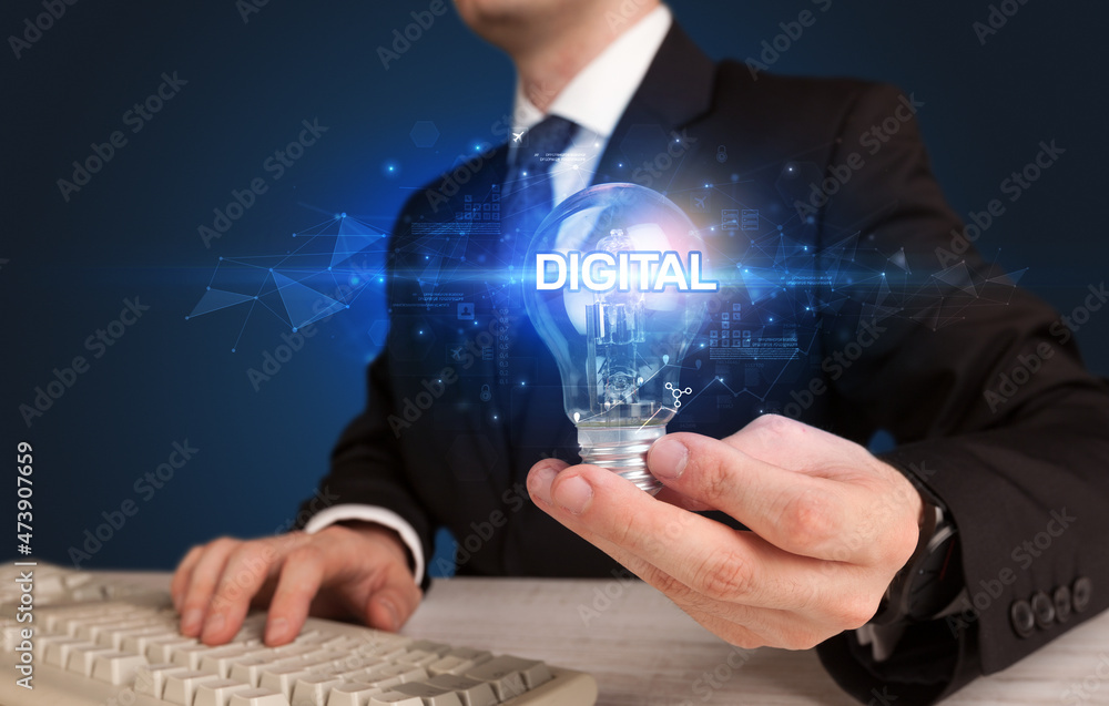 Businessman holding a light bulb Businessman holding a light bulb
