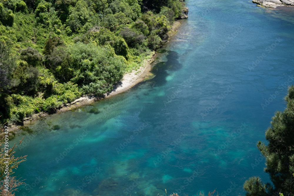 Waikato River below in natural landscape at Taupo.