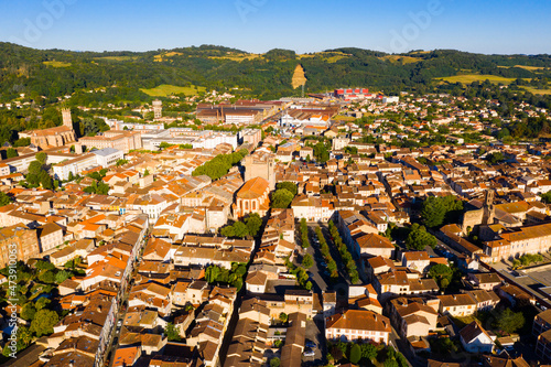 Scenic drone view of Pamiers summer cityscape surrounded by hills in ancient fertile plain of Ariege River, France photo