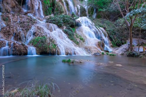 Erawan waterfalls in the national park mountains of Kanchanaburi BKK Bangkok Thailand lovely turquoise blue creamy waters lush green trees smooth rock formations