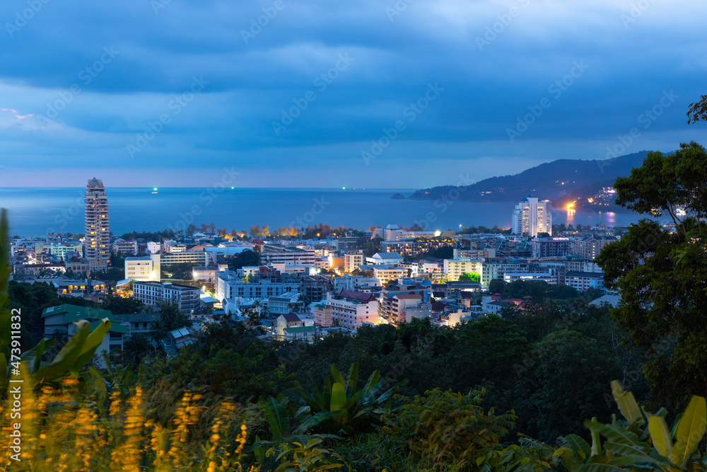Fototapeta premium night sunset view of Patong and patong beach with the buildings and high-rise hotels and resorts in the background Kathu phuket Thailand 