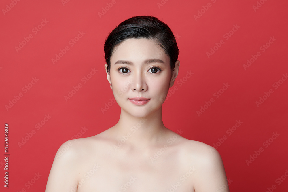Beautiful young asian woman with clean fresh skin on red background, Face care, Facial treatment, Cosmetology, beauty and spa, Asian women portrait. Beautiful young asian woman with clean fresh skin on red background, Face care, Facial treatment, Cosmetology, beauty and spa, Asian women portrait.