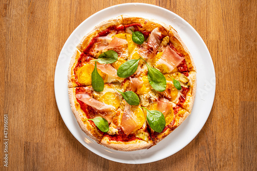 fresh pizza on the wooden background