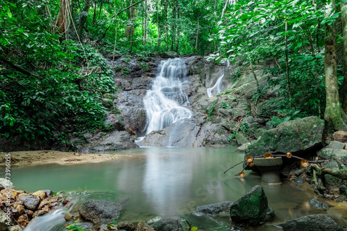 Fototapeta Naklejka Na Ścianę i Meble -  Kathu waterfall water gently flowing down the rocks Patong Phuket Thailand Asia