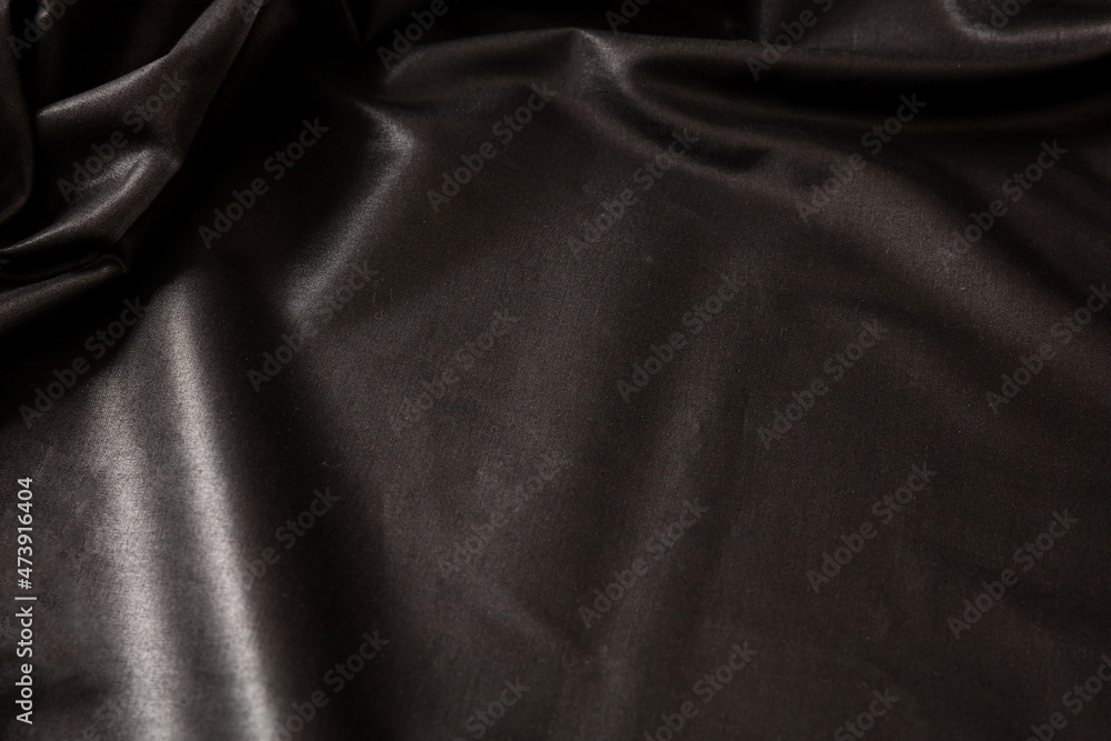 Black silk background luxury fabric texture, satin material, Christmas elegant abstract backdrop