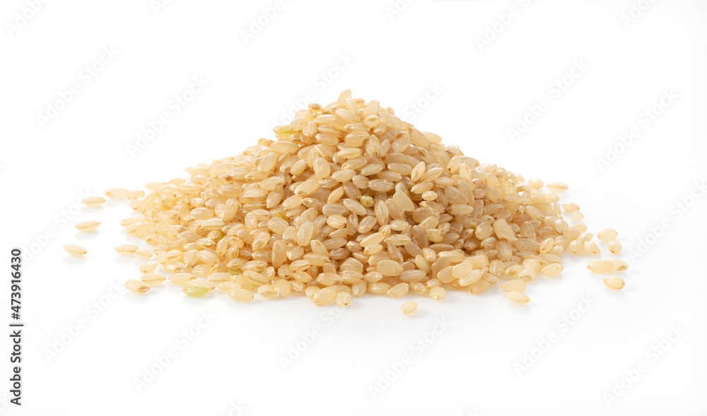 Brown rice on a white background. Brown rice on a white background.