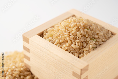 Brown rice on a white background.