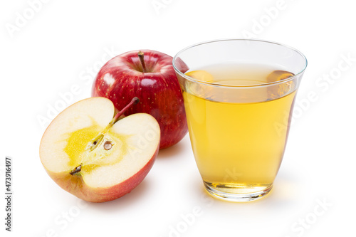 Apple juice in a glass cup on a white background