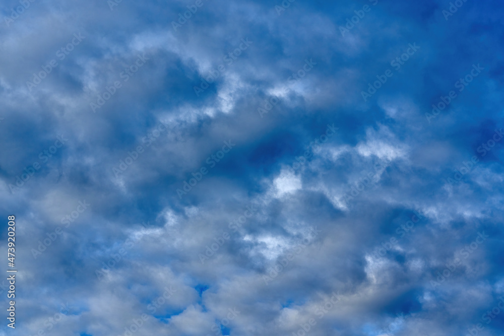 White cumulus clouds on blue sky background, natural phenomenon
