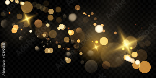 Beautiful gold glitter stars on abstract black background are used for celebrations.