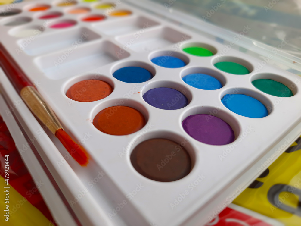 painting and art purpose dry watercolor cakes set with brush top view painting and art purpose dry watercolor cakes set with brush top view
