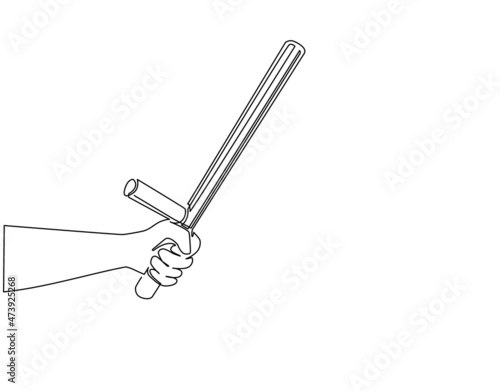 Single one line drawing hand holding police bat. Policeman ammunition, security rubber baton. Black truncheon with handle. Guard weapon. Modern continuous line draw design graphic vector illustration photo
