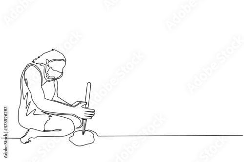 Single one line drawing prehistoric man making fire by rubbing twigs. Primitive people starting bonfire with hand drill. Modern continuous line draw design graphic vector illustration