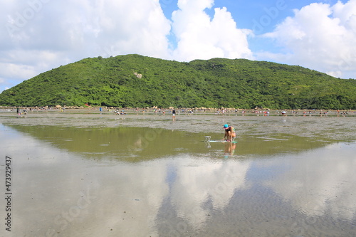 sea tide back and shadow water, reflect the cloudy sky in Lantau island, Shui Hau