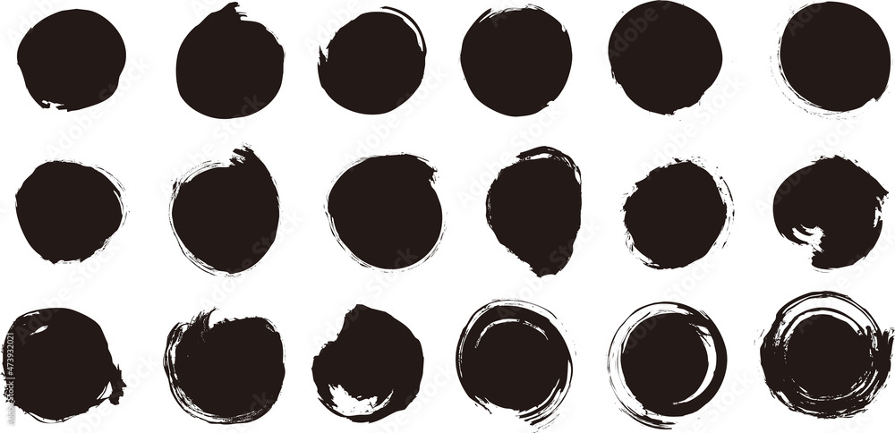 A set of black circles painted with a brush. A set of black circles painted with a brush.