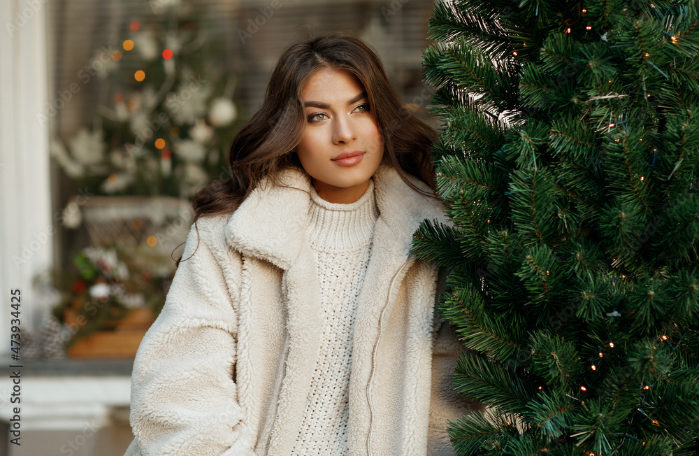 Young beautiful woman on New Year's street Young beautiful woman on New Year's street