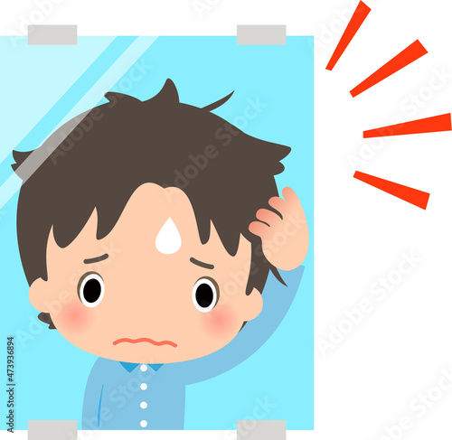鏡で寝ぐせを見て困っている男性
