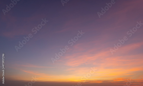 Sunset sky. Abstract nature background. Dramatic blue with orange colorful clouds in twilight time.