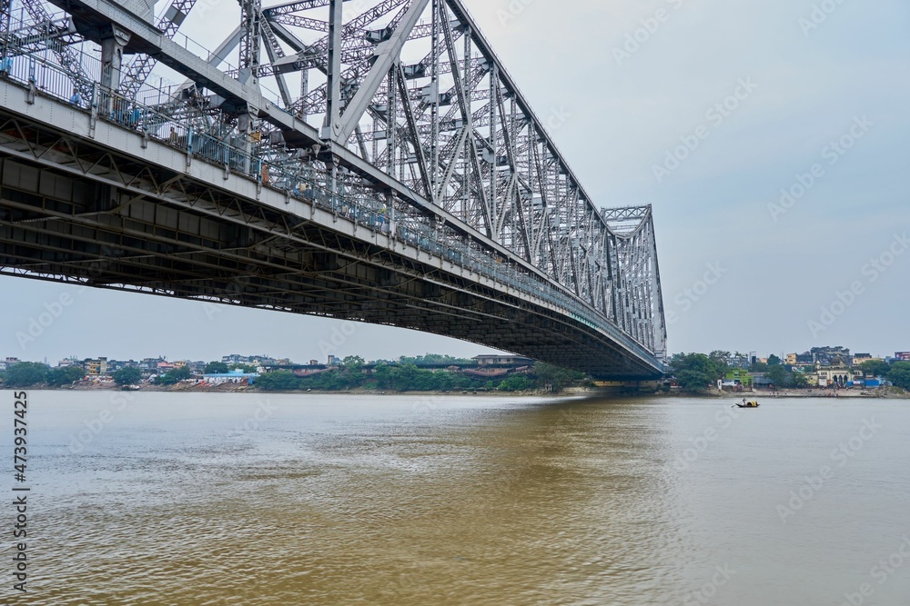 The towering Howrah Bridge spans the Hooghly river at Calcutta