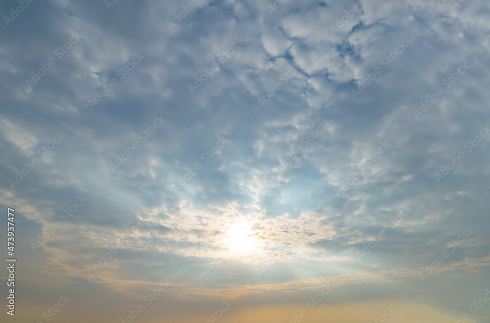 Sunset sky. Abstract nature background. Dramatic blue with orange colorful clouds in twilight time.