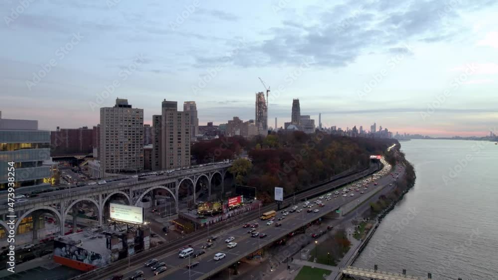Long aerial shot of traffic on Manhattan's West Side Highway with NYC skyline in the distance Long aerial shot of traffic on Manhattan's West Side Highway with NYC skyline in the distance