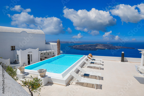 Greek island of Santorini. Amazing travel panorama, white houses, stairs and flowers on the streets. Idyllic summer vacation, urban landscape, tourism destination scenic. Oia, Thira panoramic views 