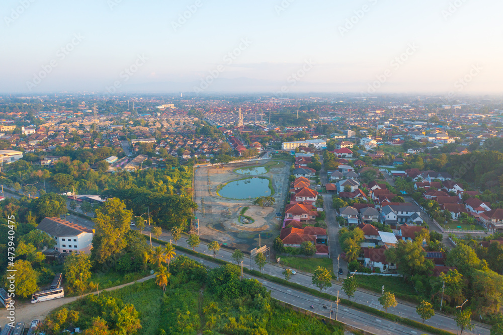 Aerial view of Chiang Mai Downtown Skyline, Thailand. Financial district and business centers in smart urban city in Asia. Skyscraper and high-rise buildings at sunset.
