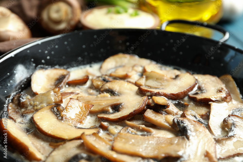 Concept of tasty food with mushroom sauce on wooden background Concept of tasty food with mushroom sauce on wooden background