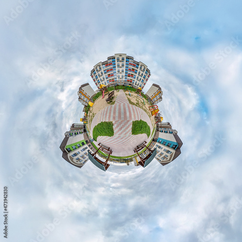 Wallpaper Mural tiny planet in blue sky with clouds in modern multi-storey multi-apartment residential complex of urban development. Transformation of spherical 360 panorama in abstract aerial view. Torontodigital.ca