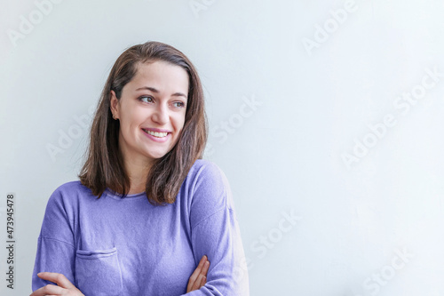 Young happy positive smiling woman, clothes blouse shirt colored in trendy color of year 2022 Very Peri, white background isolated. Inspired by using color 17-3938, Color of the year concept. © Юлия Завалишина