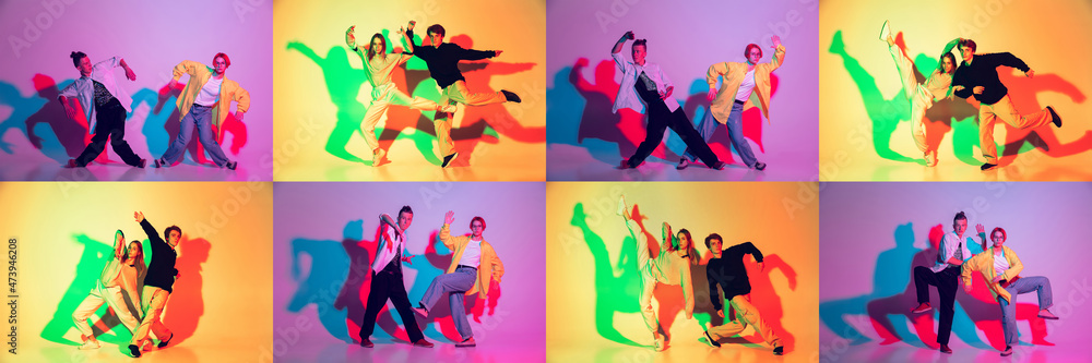 Group of teens, boys and girls dancing hip-hop in stylish clothes on gradient studio background in neon light.