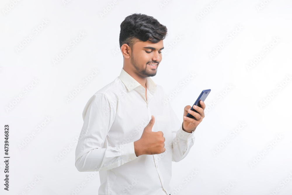 young man using smartphone on white background. young man using smartphone on white background.
