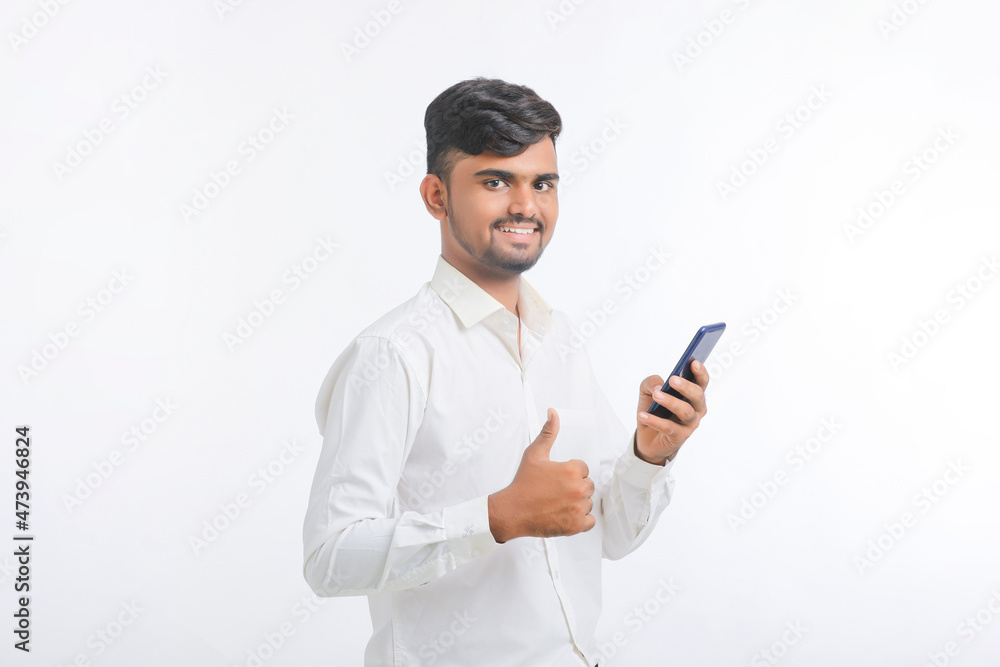 young man using smartphone on white background. young man using smartphone on white background.