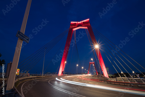 red illuminated Willems Bridge in Rotterdam photo