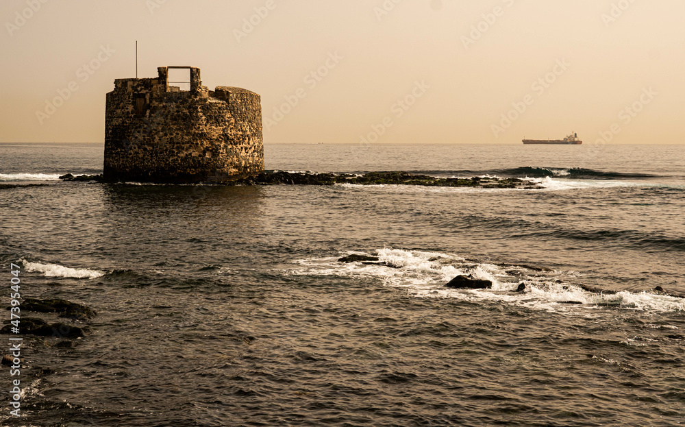 picturesque fishing village on the coast of the canary islands of gran canaria called san cristobal with houses, fishermen and the castle of light in las palmas