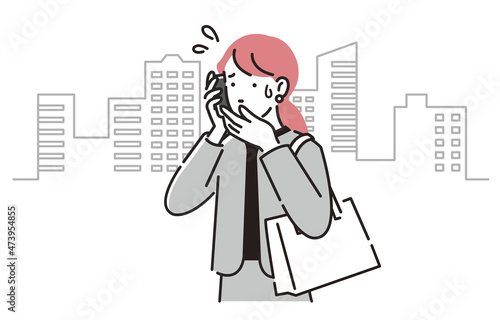 オフィス街で電話をするビジネスパーソン女性2