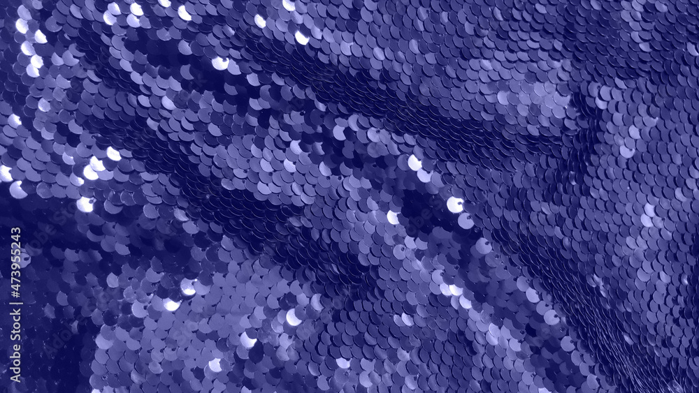 Festive violet texture of sequins or tinsel for New year evening dress. Abstract background. Close up. Festive violet texture of sequins or tinsel for New year evening dress. Abstract background. Close up.