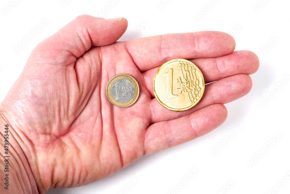 Normal euro coin and abstract golden euro coin on a palm of a hand white background. Banking and finance industry. Investment in safe asset concept. Normal euro coin and abstract golden euro coin on a palm of a hand white background. Banking and finance industry. Investment in safe asset concept.